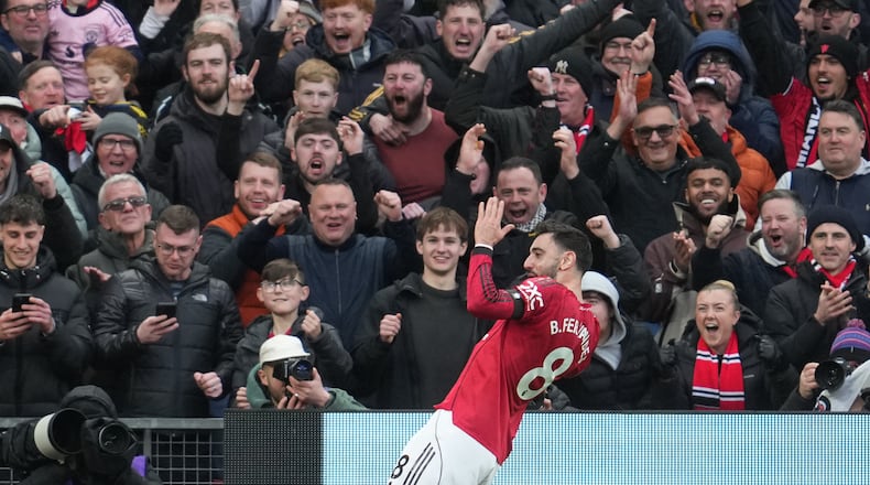 Manchester United's Bruno Fernandes celebrates after scoring during the English Premier League soccer match between Manchester United and Tottenham in Manchester, England, Saturday, Feb. 7, 2026. (AP Photo/Jon Super)