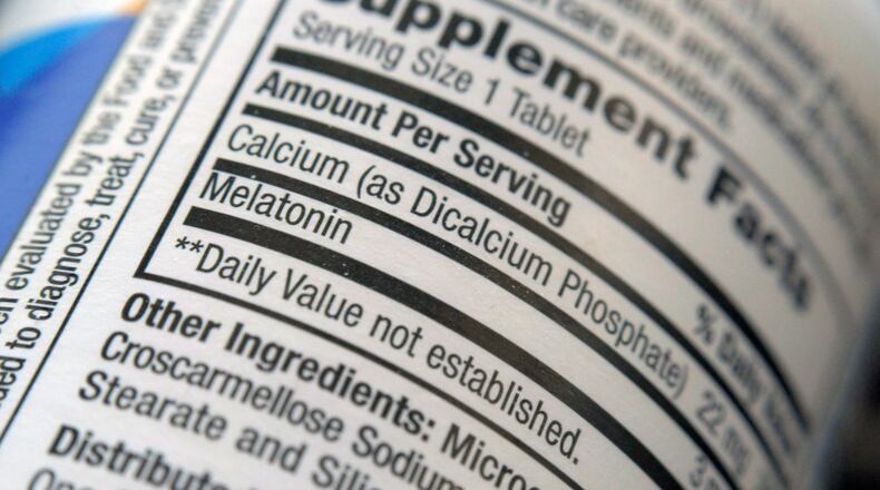 The label for a bottle of melatonin pills is seen in New York on Thursday, June 2, 2022. Melatonin is a hormone that helps control the body's sleep cycle. (AP Photo/Patrick Sison)