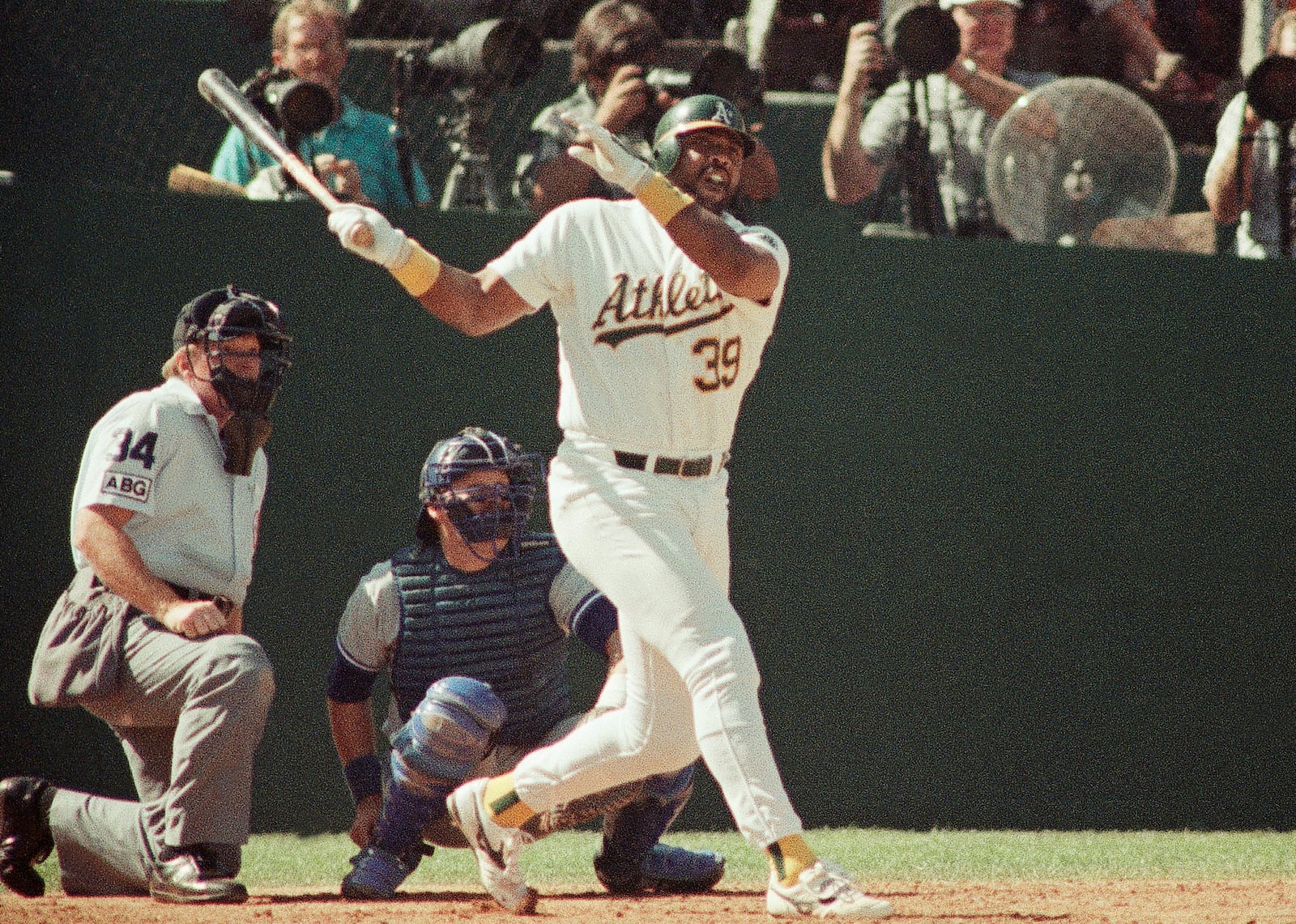 FILE - Oakland Athletics' Dave Parker (39) watches the ball fly over the right center field wall for a sixth inning solo home run in Game 2 of the American League Championship baseball series against the Toronto Blue Jays, at Oakland, Calif., Oct. 4, 1989. (AP Photo/John Gaps III, File)