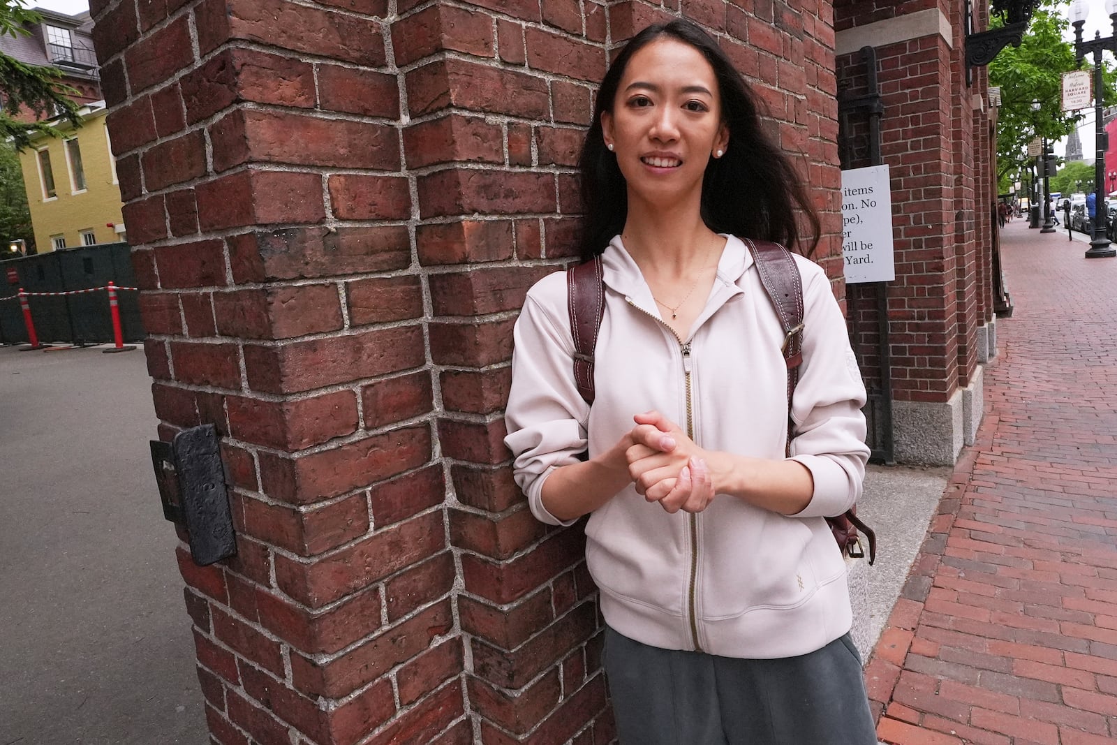 Yurong "Luanna" Jiang, who delivered a speech at her Harvard University commencement, poses at a gate to Harvard Yard, Friday, May 30, 2025, in Cambridge, Mass. (AP Photo/Charles Krupa)