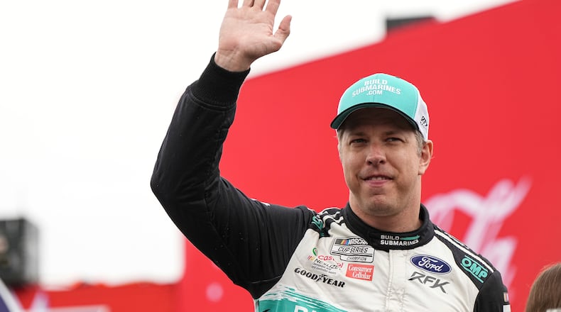 FILE - Brad Keselowski is introduced to fans prior to a NASCAR Cup Series auto race at Charlotte Motor Speedway, May 25, 2025, in Concord, N.C. (AP Photo/Matt Kelley, File)