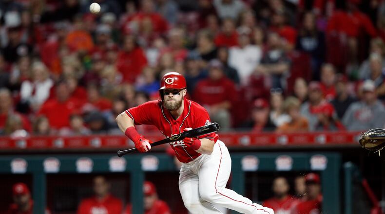 CINCINNATI, OH - SEPTEMBER 28: Tucker Barnhart #16 of the Cincinnati Reds bunts for a single in the seventh inning against the Pittsburgh Pirates at Great American Ball Park on September 28, 2018 in Cincinnati, Ohio. The Pirates won 8-4. (Photo by Joe Robbins/Getty Images)
