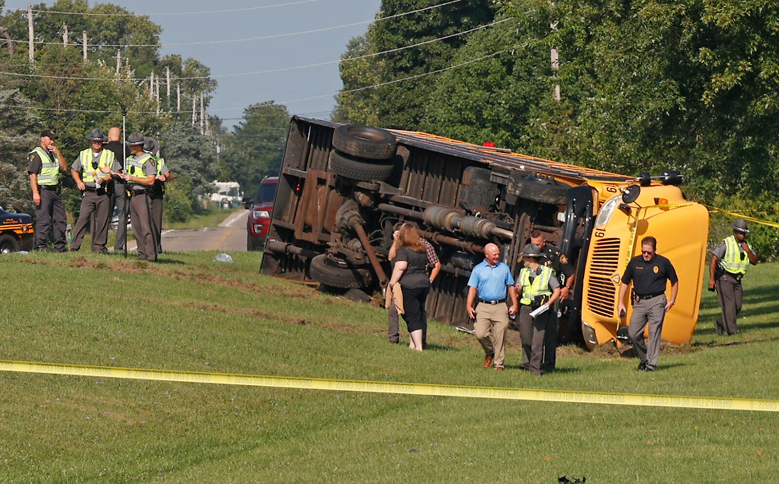 Authorities work on the scene of a bus crash in Lawrenceville, Ohio, Tuesday, Aug. 22, 2023. (Bill Lackey/STAFF)