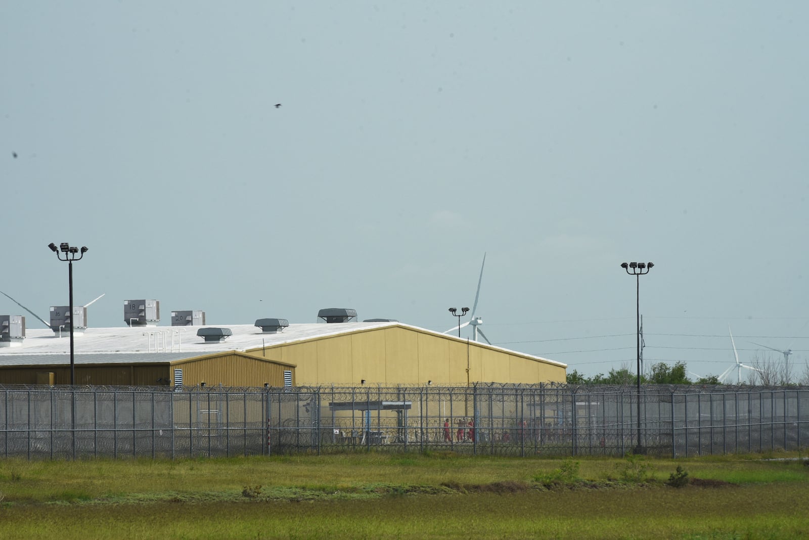 FILE - Detainees held at El Valle Detention Center in Raymondville, Texas are seen outside briefly, Thursday, May 1, 2025, after a federal judge in the district barred the Trump administration from deporting any Venezuelans from South Texas under the Alien Enemies Act, an 18th-century wartime law. (AP Photo/Valerie Gonzalez, File)