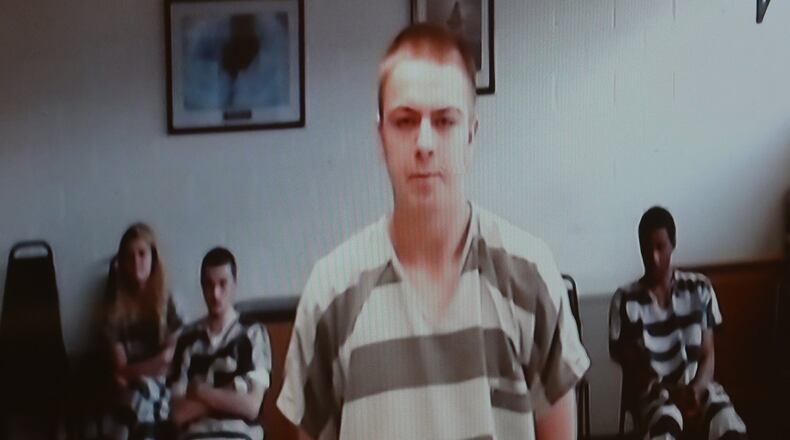 Joshua Adkins is arraigned in Clark County Municipal Court Friday. BILL LACKEY/STAFF