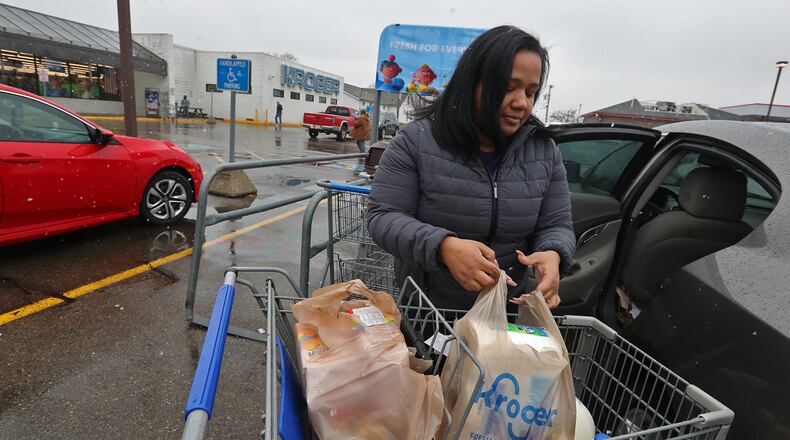 Meghan Davila says she's disappointed that the Kroger grocery store on South Limestone Street will be closing on March 4. Davila said she lives on the east side of Springfield but shops  at the Kroger on South Limestone because she likes it better. BILL LACKEY/STAFF