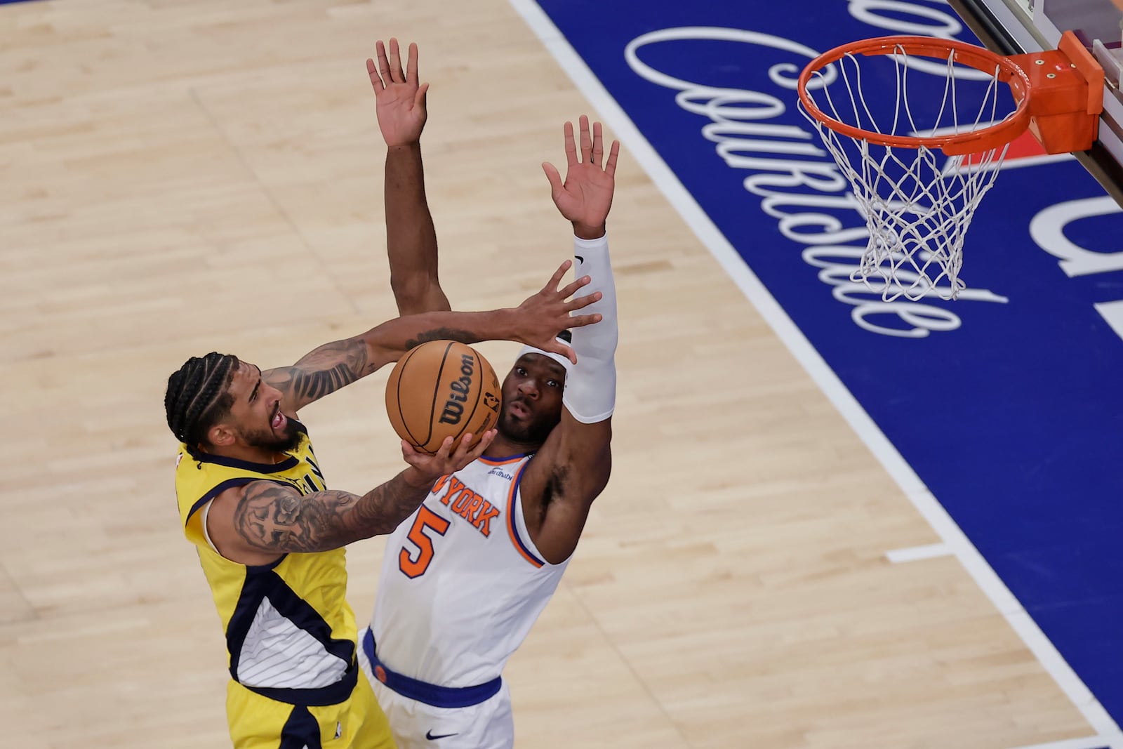 Indiana Pacers forward Obi Toppin (1) goes up for a shot against New York Knicks forward Precious Achiuwa (5) during the third quarter of Game 5 of the NBA basketball Eastern Conference finals, Thursday, May 29, 2025, in New York. (AP Photo/Adam Hunger)