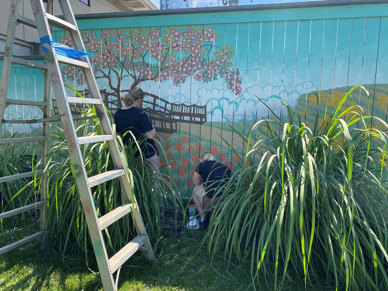 Sisters Molly Kirkpatrick (Wittenberg University rising junior) and Maddy Kirkpatrick (Miami University rising junior) helping to paint the mural.