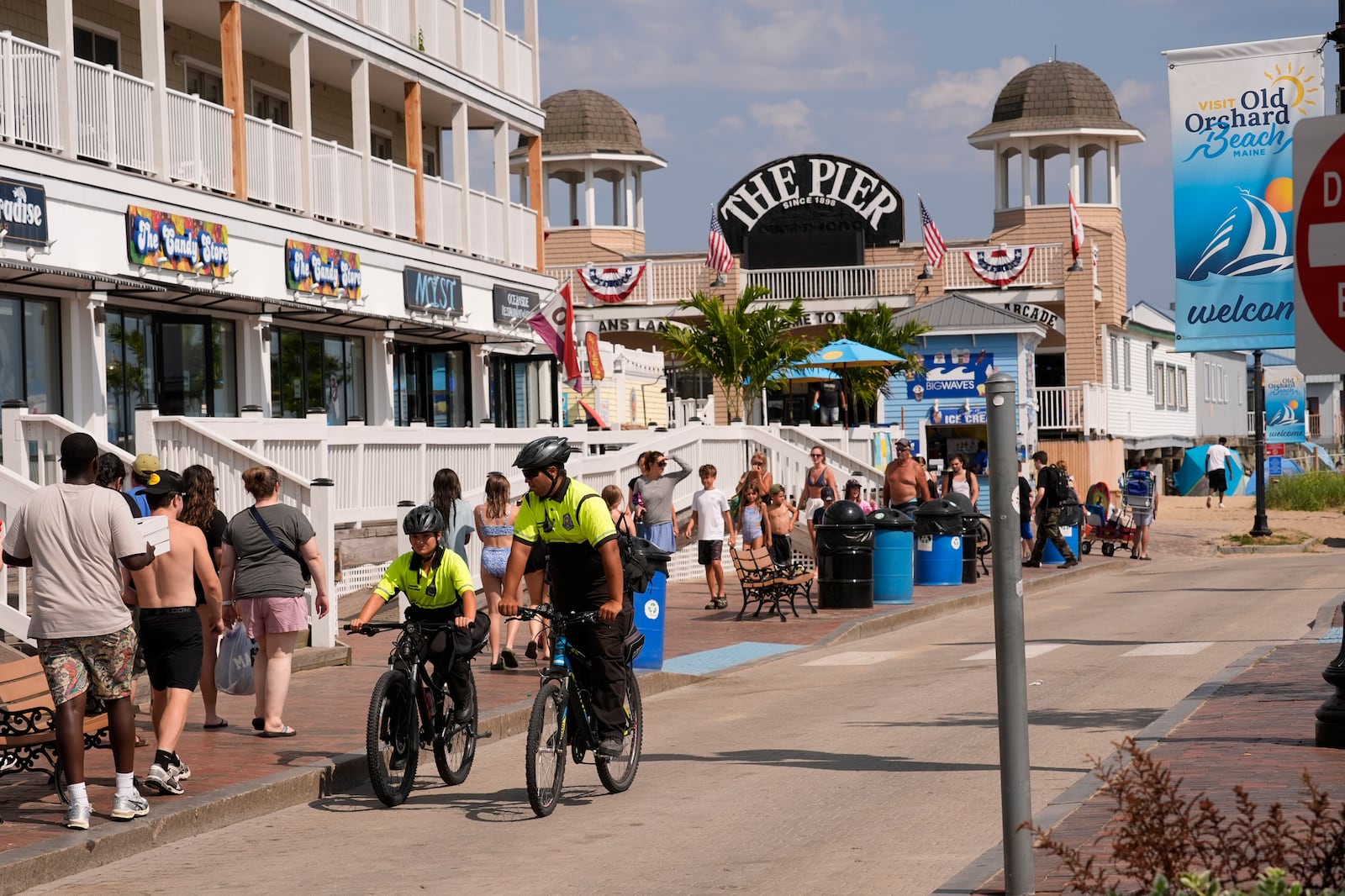 Community Service Officers from the Old Orchard Beach Police Dept. patrol on bicycles, Tuesday, July 29, 2025, in Old Orchard Beach, Maine. (AP Photo/Robert F. Bukaty)