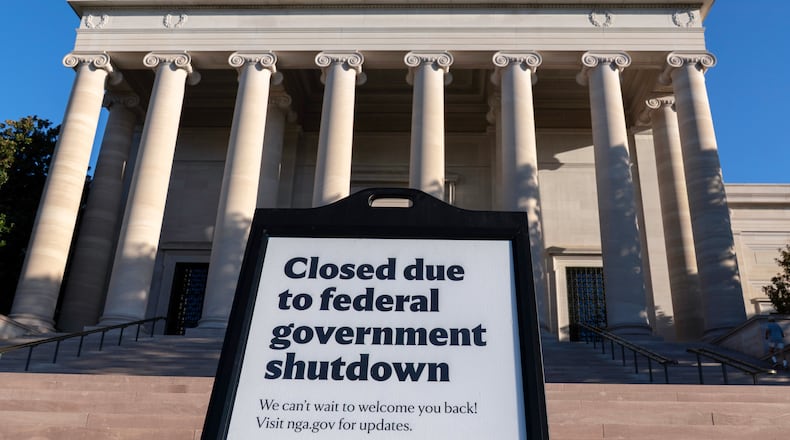 FILE - A sign that reads "Closed due to federal government shutdown," is seen outside of the National Gallery of Art on the 6th day of the government shutdown, in Washington, Oct. 6, 2025. (AP Photo/Jose Luis Magana, File)