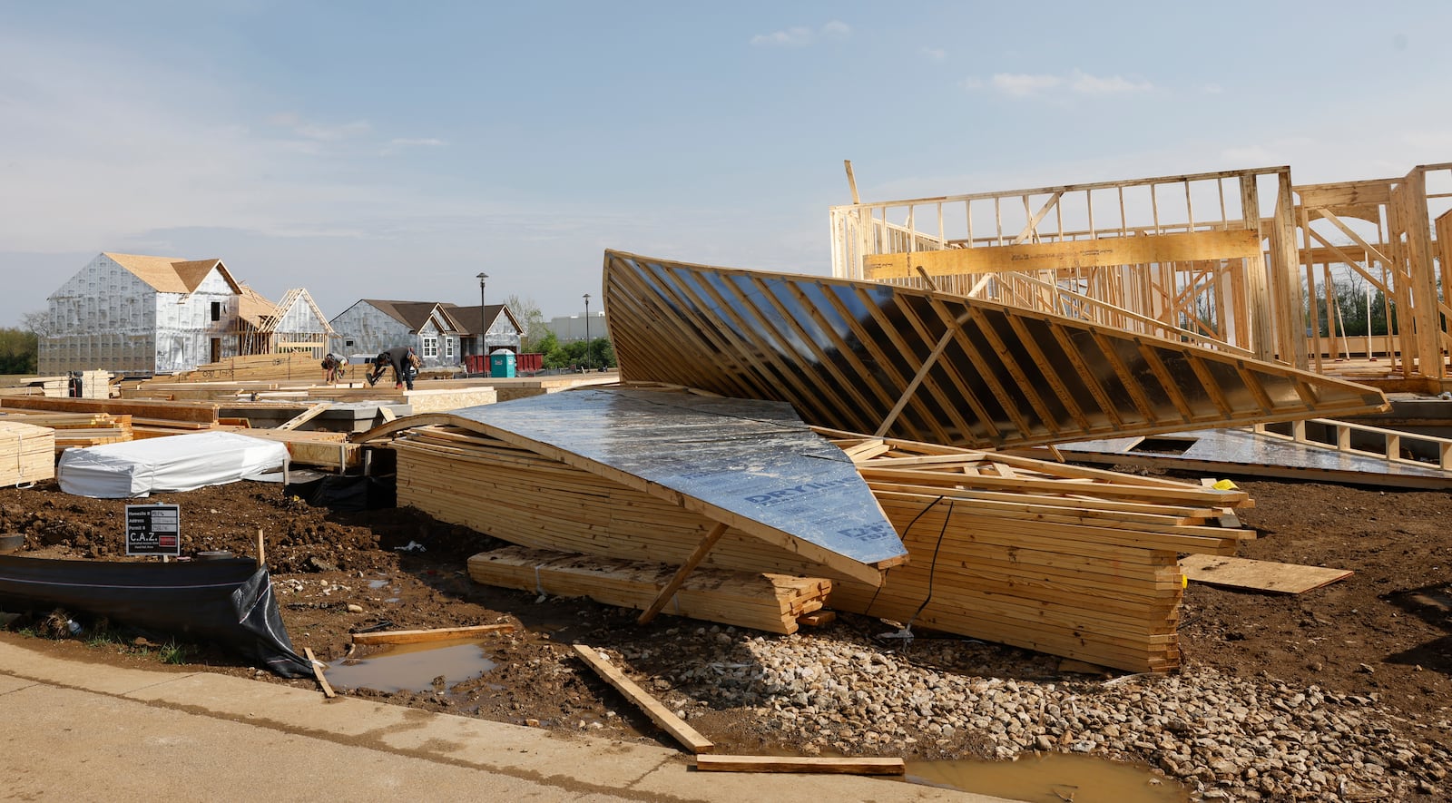 Construction men work on building houses on Tuesday, April 29, 2025, in the Fischer Homes neighborhood of Melody Parks. JOSEPH COOKE/STAFF