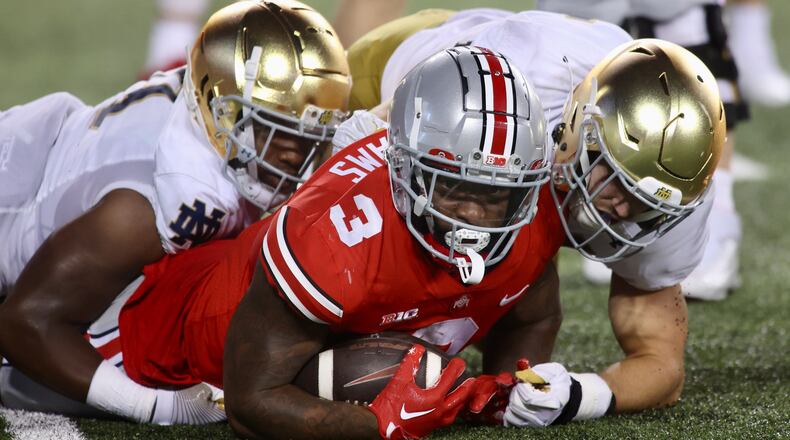 Ohio State's Miyan Williams looks up after getting tackled by Notre Dame in the second half on Saturday, Sept. 3, 2022, at Ohio Stadium in Columbus. David Jablonski/Staff