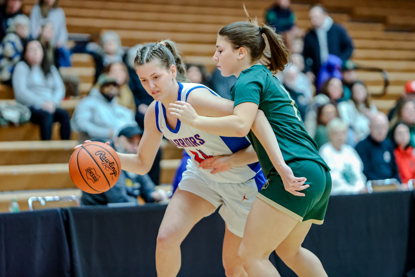 Northwestern High School sophomore Lily Bushey is guarded by Catholic Central senior Alyssa Gram during their game on Tuesday, Dec. 30, 2025 at Wittenberg University's Pam Evans Smith Arena in Springfield. MICHAEL COOPER / STAFF