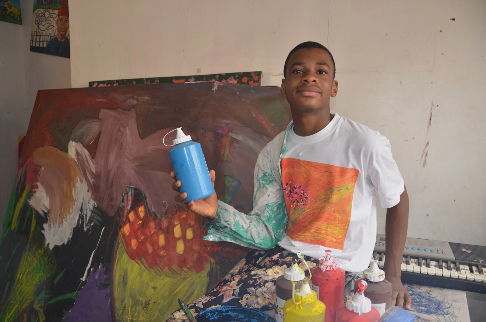 Kanyeyachukwu Tagbo Okeke, a 15 year-old autistic Nigerian, who set a Guinness World Record for the world's largest art canvas, is photograph during an interview in Abuja, Nigeria, Friday, April 18, 2025. (AP Photo/Olamikan Gbemiga)