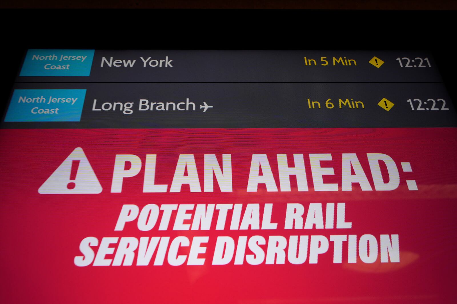 An electronic display advises commuters of potential NJ Transit service disruptions at the Secaucus Junction station in Secaucus, N.J., Wednesday, May 14, 2025. (AP Photo/Seth Wenig)