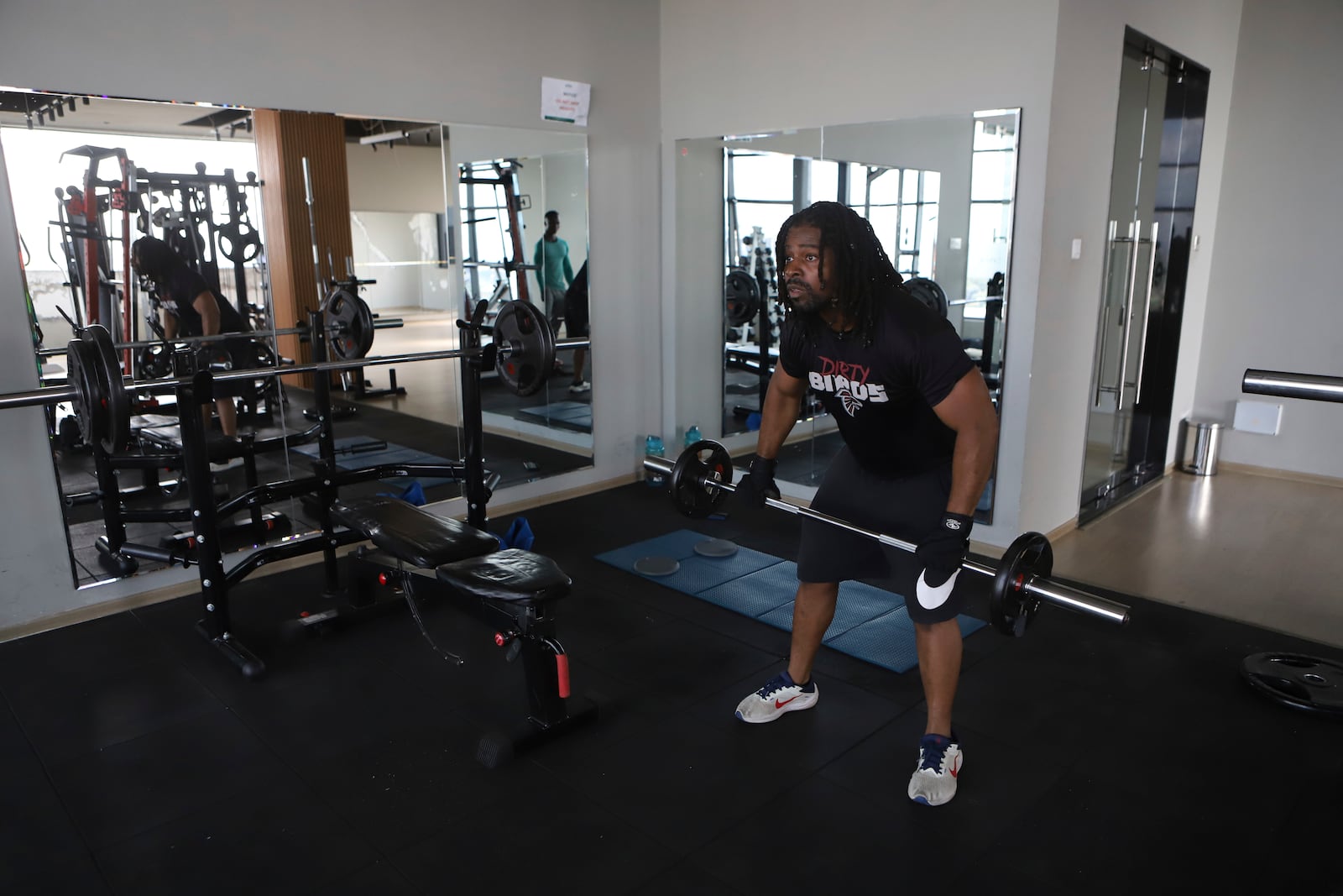 Kenneth Harris, a 38-year-old retired veteran, lifts weights at a gym in Nairobi, Kenya, Friday, May 23, 2025. (AP Photo/Andrew Kasuku)