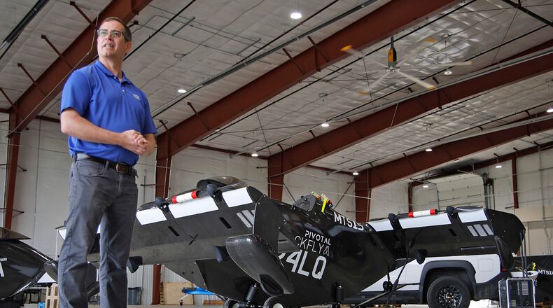 Josh Lane, flight test engineer and site manager, talks about the PIVOTAL Blackfly electric vertical takeoff and landing aircraft June 17, 2024 at the National Advanced Air Mobility Center of Excellence at Springfield-Beckley Municipal Airport. BILL LACKEY/STAFF