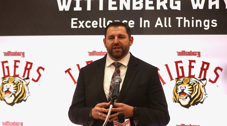 BJ Coad, left, speaks at a press conference after being introduced as Wittenbergh's new head football coach on Monday, Dec. 1, 2025, at the The Health, Wellness & Athletics Complex in Springfield. David Jablonski/Staff