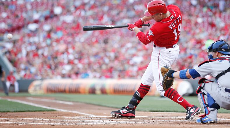 Joey Votto rips yet another hit for the Reds in a recent game at Great American Ball Park.