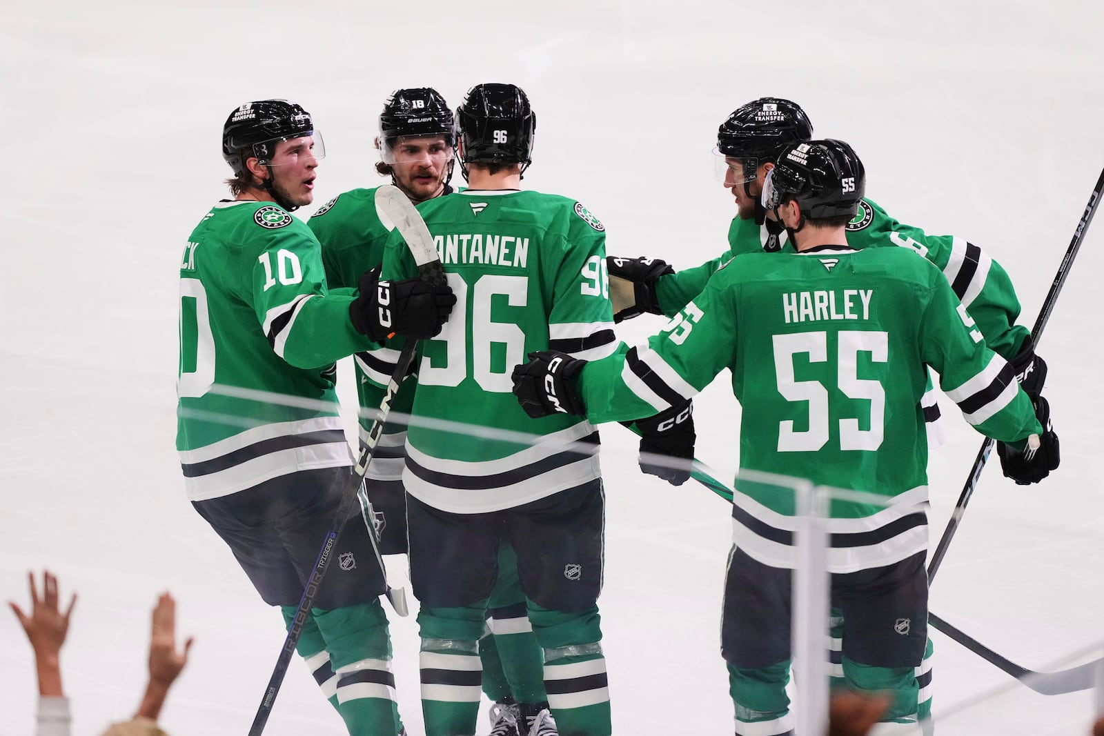 Dallas Stars' Mikko Rantanen (96) celebrates after scoring with Oskar Back (10), Thomas Harley (55) and the rest of the line in the third period in Game 7 of a first-round NHL hockey playoff series against the Colorado Avalanche Saturday, May 3, 2025, in Dallas. (AP Photo/Julio Cortez)