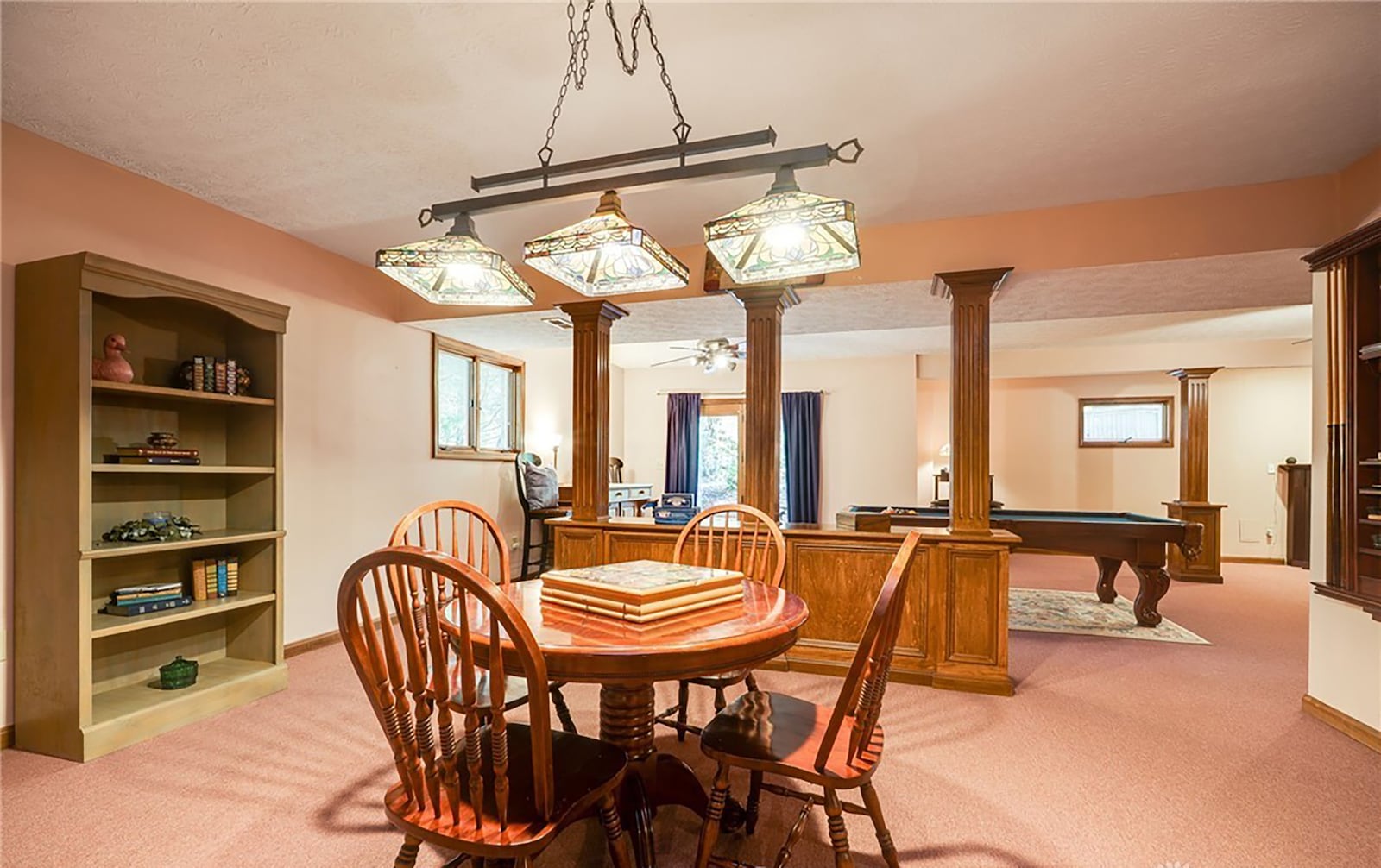 The finished basement has a recreation room with carpet, two ceiling fans and a tiffany lamp shade over gaming area. CONTRIBUTED