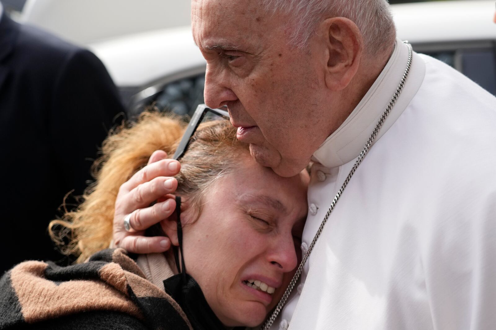 Pope Francis consoles Serena Subania who lost her daughter Angelica, 5 years old, the day before as he leaves the Agostino Gemelli University Hospital in Rome, Saturday, April 1, 2023 after receiving treatment for a bronchitis, The Vatican said. Francis was hospitalized on Wednesday after his public general audience in St. Peter's Square at The Vatican. (AP Photo/Gregorio Borgia)