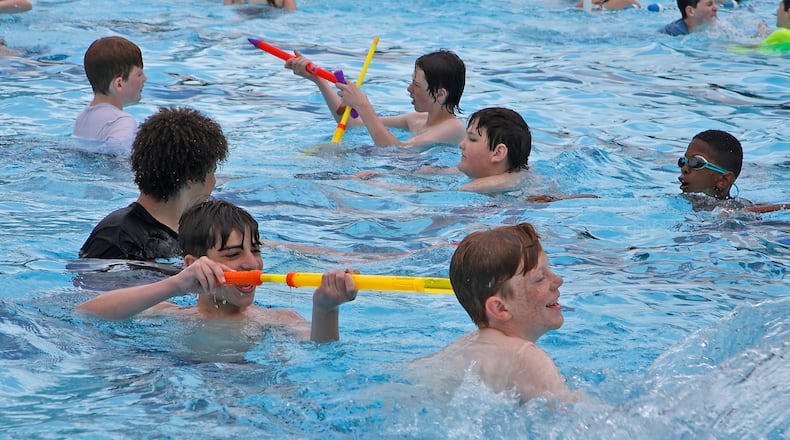 Tecumseh Middle School students got a chance to take an early dip in the New Carlisle Pool Wednesday, May 22, 2024. The pool officially opens to the public on Saturday for the Memorial Day weekend. BILL LACKEY/STAFF