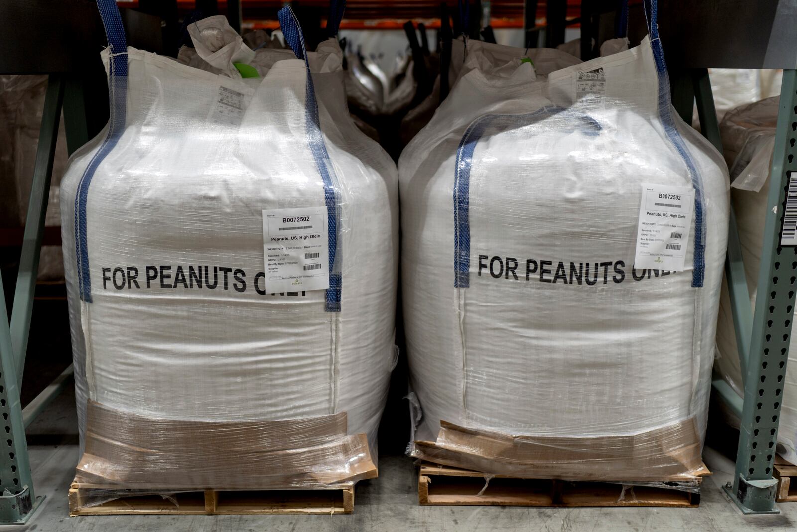Raw materials for Plumpy'Nut, a nutritional lifesaving peanut paste sent to malnourished children worldwide, sit in a warehouse at Edesia Nutrition, Friday, March 14, 2025, in North Kingstown, R.I. (AP Photo/David Goldman)