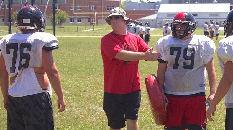 Tecumseh High School head football coach Kent Massie oversees a preseason practice in 2004. Jeff Gilbert/Contributor