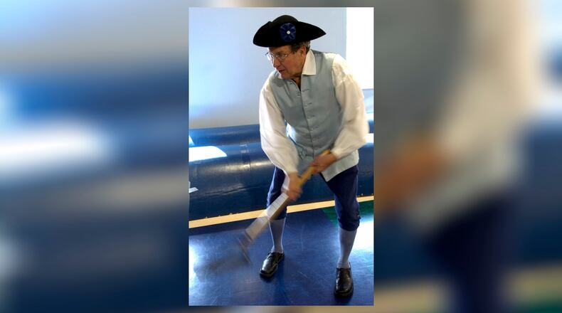 Clark County Commissioner John Detrick portrays his anscestor Daniel Detrick - a circa 1700s farmer - during Emmanual Christian School's fourth-annual government day. Staff photo by Marshall Gorby