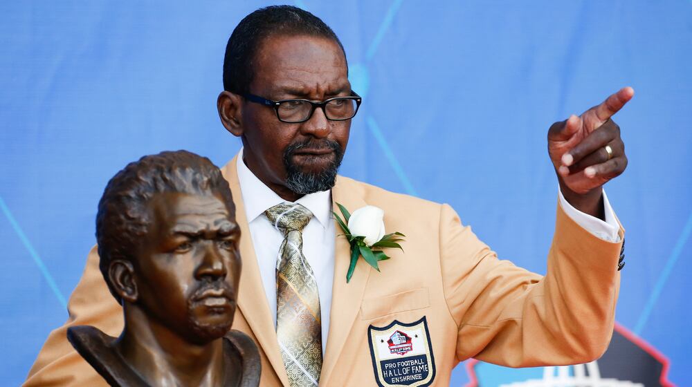 FILE - Former NFL player Kenny Easley poses with a bust of himself during an induction ceremony at the Pro Football Hall of Fame, Saturday, Aug. 5, 2017, in Canton, Ohio. (AP Photo/Ron Schwane, File)