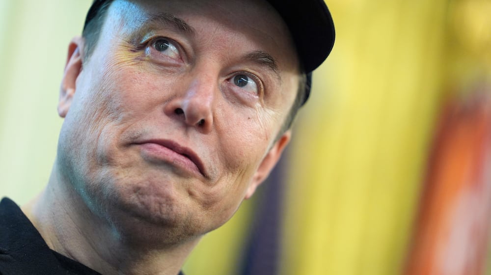 FILE - Elon Musk listens as President Donald Trump speaks during a news conference in the Oval Office of the White House, May 30, 2025, in Washington. (AP Photo/Evan Vucci, File)