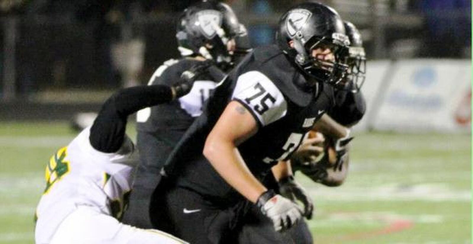 Lakota East High School’s Jarrett LaRubbio (75), seen in action during the 2012 season, is in the starting lineup for Miami University this season. CONTRIBUTED PHOTO