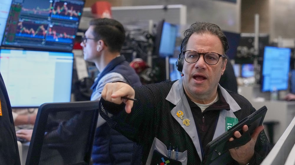 Options trader Anthony Spina works on the floor of the New York Stock Exchange, Friday, Feb. 13, 2026, in New York. (AP Photo/Richard Drew)