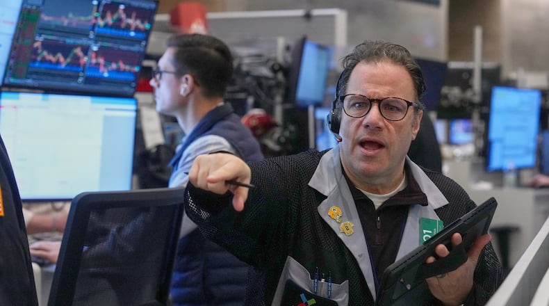 Options trader Anthony Spina works on the floor of the New York Stock Exchange, Friday, Feb. 13, 2026, in New York. (AP Photo/Richard Drew)