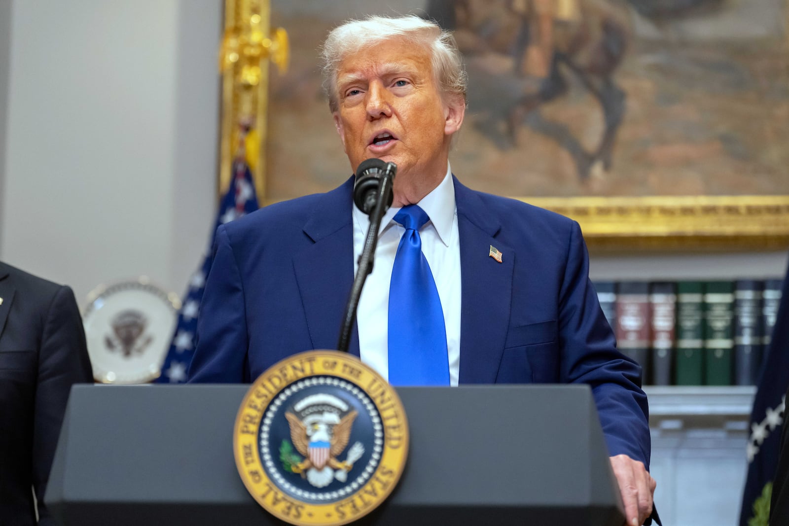 President Donald Trump answers a reporter's question during an event in the Roosevelt Room at the White House, Monday, May 12, 2025, in Washington. (AP Photo/Mark Schiefelbein)