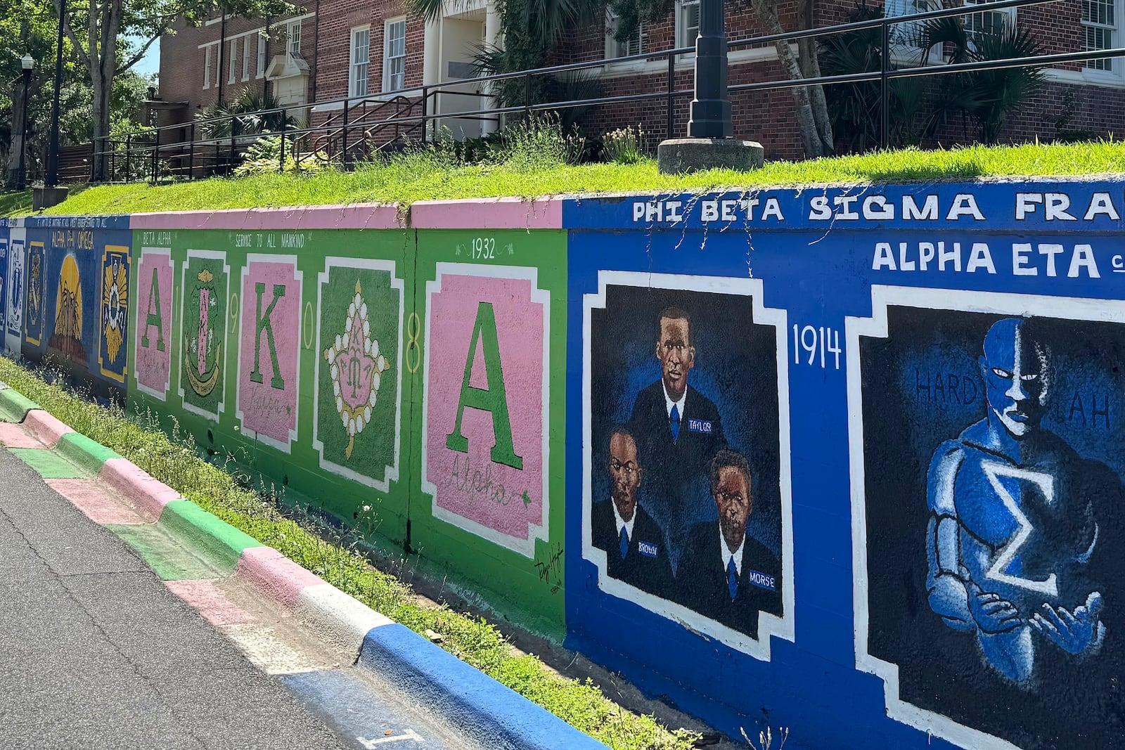 Murals celebrating historically Black fraternities and sororities decorate the campus of Florida AM University in Tallahassee, Fla., Wednesday, May 14, 2025. (AP Photo/Kate Payne)