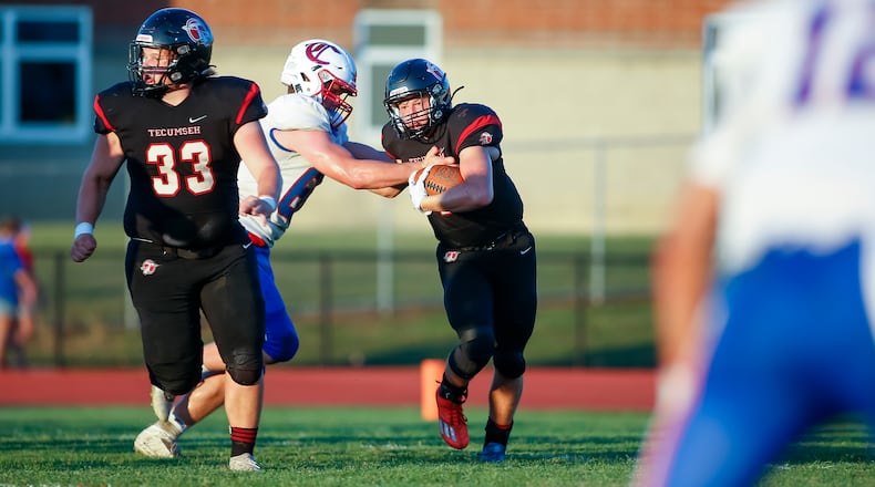 Tecumseh High School senior Lucas Berner carries the ball during their game against Carroll at Spitzer Stadium in New Carlisle earlier this season. CONTRIBUTED PHOTO BY MICHAEL COOPER