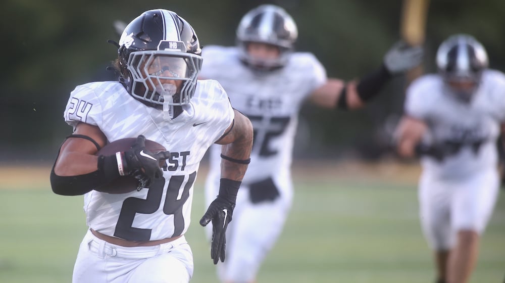 Lakota East’s Ryder Hooks runs for a touchdown against Centerville on Friday, Aug. 22, 2025, at Centerville Stadium. David Jablonski/Staff