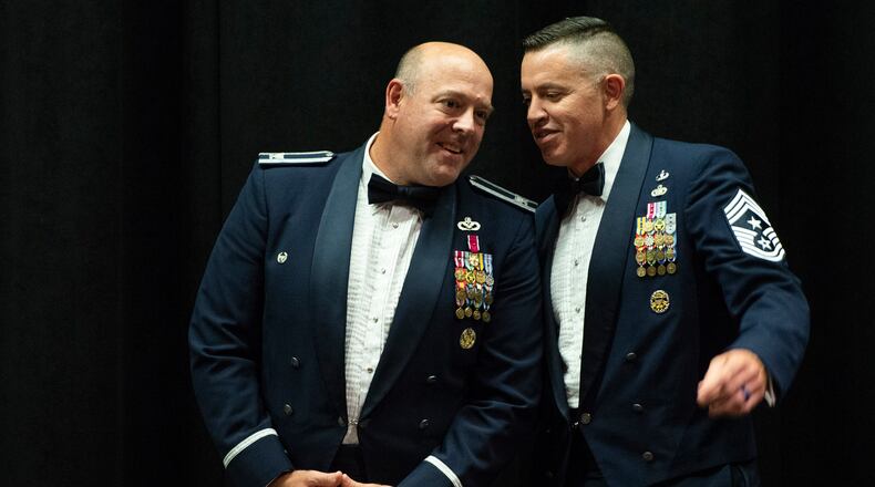 U.S. Air Force Col. Patrick Miller, 88th Air Base Wing and installation commander, left, talks with Chief Master Sgt. Jason Shaffer, 88th ABW command chief, prior to the start of the Chief Master Sgt. Induction Medallion Ceremony inside the National Museum of the United States Air Force, at Wright-Patterson Air Force Base, Ohio, July 10, 2021. (U.S. Air Force photo by Wesley Farnsworth)