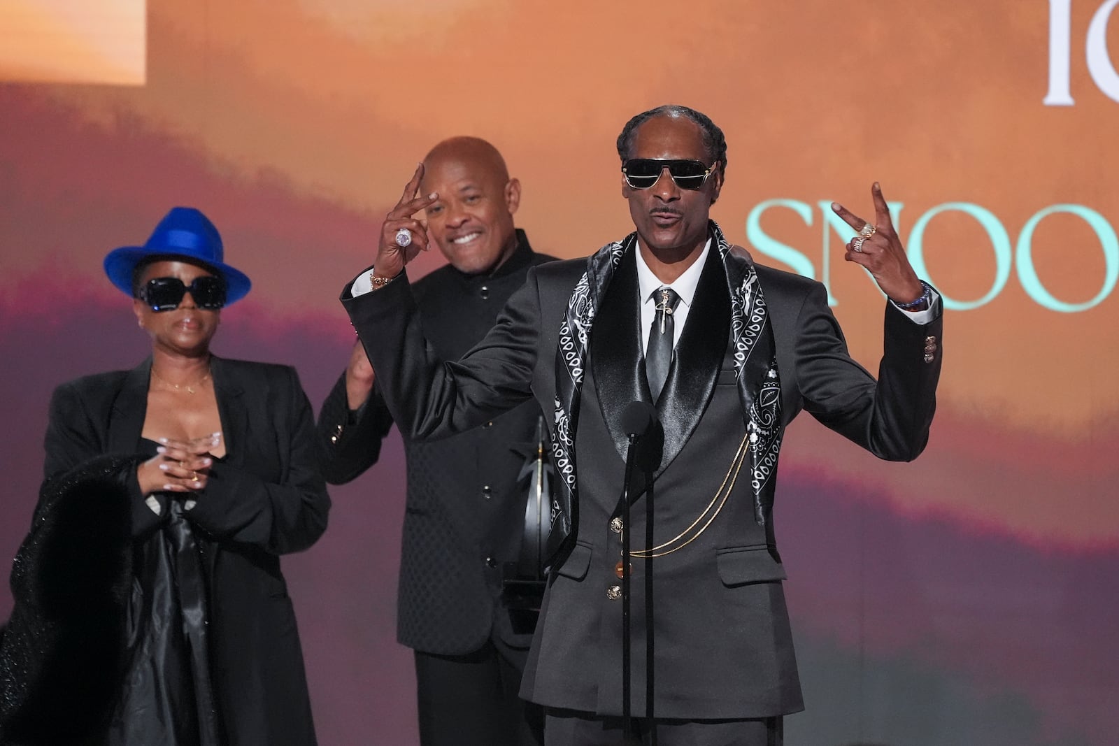 Snoop Dogg, right, accepts the ultimate icon award during the BET Awards on Monday, June 9, 2025, at the Peacock Theater in Los Angeles. Shante Broadus, far left, and Dr. Dre look on from left,(AP Photo/Chris Pizzello)