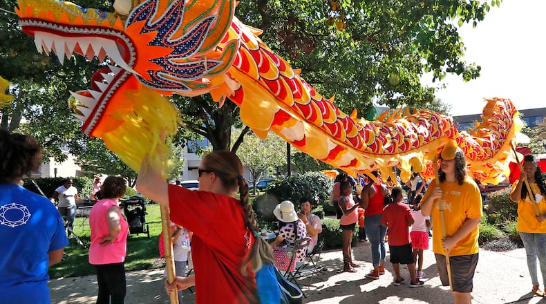 A Chinese dragon dances through the crowd at CultureFest in 2017 in downtown Springfield. Bill Lackey/Staff