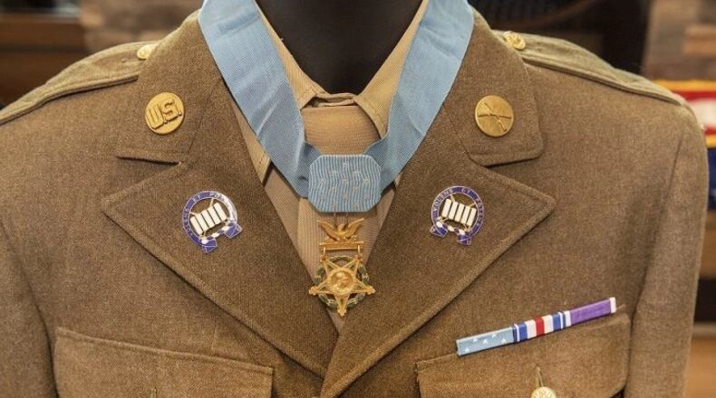 An authentic uniform and Medal of Honor were presented at a ceremony that named a Colorado Springs, Colo., health clinic after World War II Army Pfc. Floyd Lindstrom. Air Force photo by Visual Information Specialist Shawn Fury