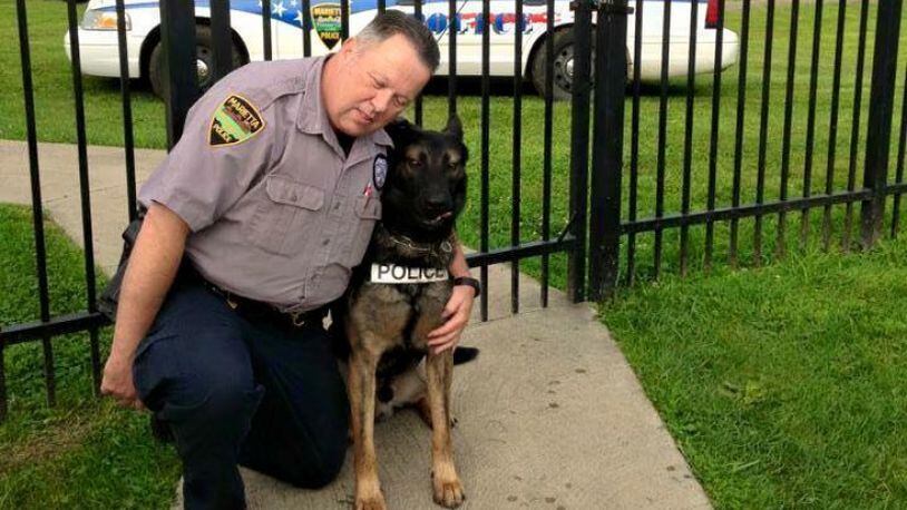 Retired Marietta police Officer Matt Hickey and his longtime partner Ajax. (Contributed)
