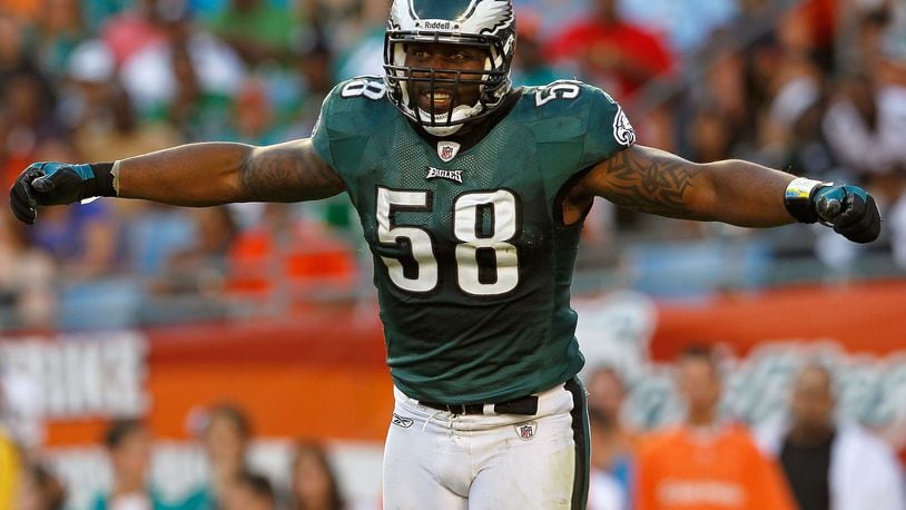 MIAMI GARDENS, FL - DECEMBER 11:   Trent Cole #58 of the Philadelphia Eagles celebrates a sack during a game against the Miami Dolphins at Sun Life Stadium on December 11, 2011 in Miami Gardens, Florida.  (Photo by Mike Ehrmann/Getty Images)