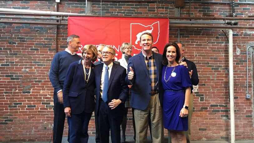 Mike DeWine, Jon Husted and other Republican candidates take part in a GOP bus tour in Columbus on Thursday. Photo by Laura Bischoff.