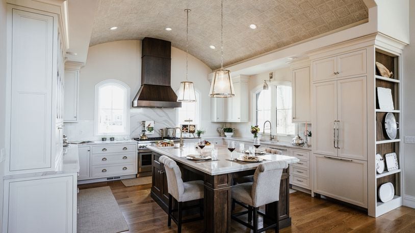 The Wakers' gourmet-style kitchen is open to the great room, and the large island is perfect for family gatherings and entertaining. It features a barrel-tile ceiling that was hand-placed by Ed and high school friend Jeff Duke. CONTRIBUTED PHOTOS