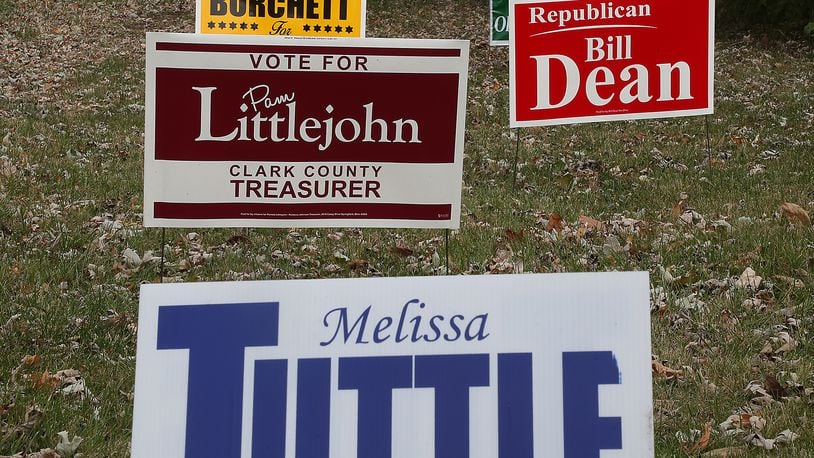 Election signs for Republican candidates decorate a yard along Enon Road. BILL LACKEY/STAFF