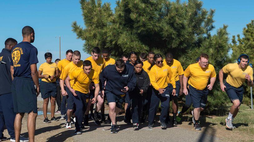 Sailors perform the 1.5-mile run during the physical readiness test (PRT) on a running path on Naval Station (NAVSTA) Norfolk. Truman is currently moored at NAVSTA Norfolk preparing for future operations. (U.S. Navy photo by Mass Communication Specialist Seaman Thomas Bonaparte Jr./Released)