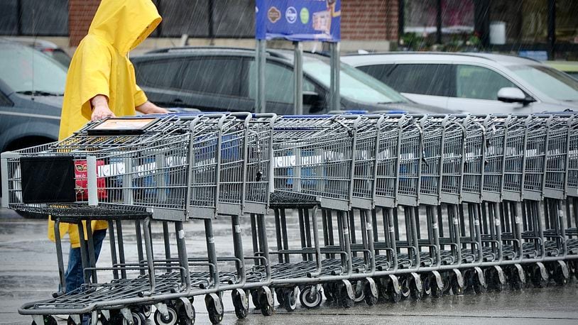Neither rain nor snow or sleet will stop the return of shopping carts to the Kroger Market Place in Beavercreek, Wednesday, April 5, 2023. MARSHALL GORBY \STAFF